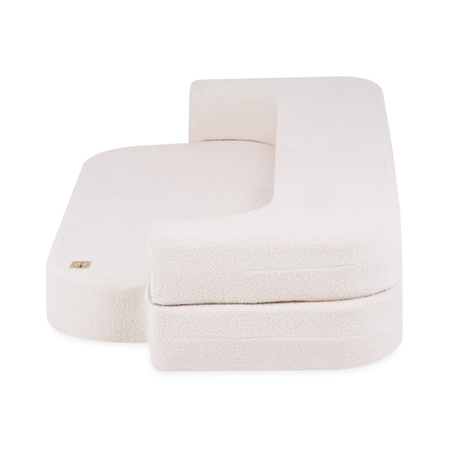 PLUSH NEST Schlafsofa Foldie, cremefarbenes Lammfell